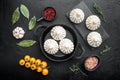 Uncooked Baozi chinese dumplings. Azian dumplings, on black stone background, top view flat lay