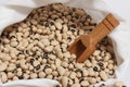 Uncooked Black Eyed Peas in Bag With Wooden Scoop Royalty Free Stock Photo