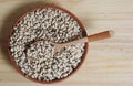 Uncooked Black Eyed Peas in Bowl on Wooden Table Royalty Free Stock Photo