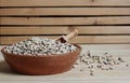 Uncooked Black Eyed Peas in Bowl on Wooden Table Royalty Free Stock Photo