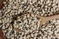 Uncooked Black Eyed Peas in Bowl on Wooden Table Royalty Free Stock Photo