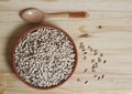 Uncooked Black Eyed Peas in Bowl on Wooden Table Royalty Free Stock Photo