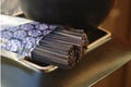 Uncooked black rice soba noodles on a plate Royalty Free Stock Photo