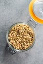 Uncooked brown lentils. Raw legume in jar Royalty Free Stock Photo