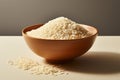 Uncooked brown rice, simply arranged in a clean, white bowl