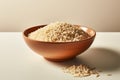 Uncooked brown rice, simply arranged in a clean, white bowl