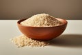 Uncooked brown rice in a white bowl, a simple and pure image