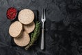 Uncooked Burgers cutlets made from plant based meat, raw vegan patties. Black background. Top view. Copy space Royalty Free Stock Photo
