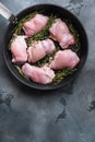 Uncooked chicken thighs  with thime on grill pan on grey backgroundtop viewwith space for text Royalty Free Stock Photo