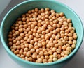 Uncooked chickpea in a turquoise bowl