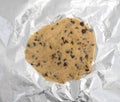 Uncooked chocolate chip cookie on tinfoil Royalty Free Stock Photo