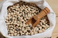 Uncooked Dried Black Eyed Peas in Bag With Wooden Scoop Royalty Free Stock Photo