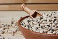 Uncooked Dried Black Eyed Peas in Bowl on Wooden Table Royalty Free Stock Photo