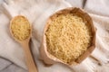 Uncooked filini pasta on sackcloth, top view Royalty Free Stock Photo