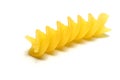Uncooked fusilli pasta isolated on white background. Itallian spiral pasta close-up on white background Royalty Free Stock Photo