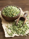 Uncooked Green Split Peas in a bowl with a spoon Royalty Free Stock Photo