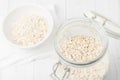 Uncooked instant oatmeal in glass jar, shorth depth of field