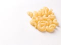 Uncooked macaroni elbow shape pasta with white background stock image. Royalty Free Stock Photo