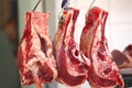 Uncooked meat hanging on Royalty Free Stock Photo