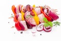 Uncooked mixed meat skewer with peppers.Raw chicken leg meat skewers with vegetables,plums,peppers,onions, on a white