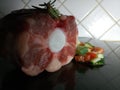 Cut of raw oxtail with chopped vegetables Royalty Free Stock Photo
