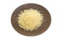 Uncooked parboiled rice on the brown dish