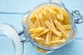 Uncooked pasta caserecce in jar Royalty Free Stock Photo