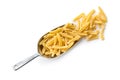 Uncooked pasta caserecce in metal scoop Royalty Free Stock Photo