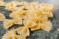 Uncooked pasta farfalle on the table. Royalty Free Stock Photo