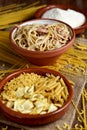 Uncooked pasta, spaghetti alla carbonara and grated cheese Royalty Free Stock Photo