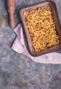 Uncooked pasta in tray above Royalty Free Stock Photo