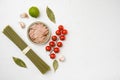 Uncooked Pasta with vegetables and tuna ingredients, on white stone table background, top view flat lay, with copy space for text Royalty Free Stock Photo