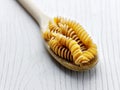 Uncooked pasta wooden spoon Royalty Free Stock Photo