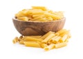 Uncooked penne pasta in bowl. Dried italian pasta Royalty Free Stock Photo