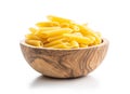 Uncooked penne pasta in bowl. Dried italian pasta Royalty Free Stock Photo