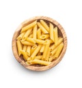 Uncooked penne pasta in bowl. Dried italian pasta Royalty Free Stock Photo