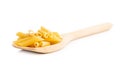 Uncooked penne pasta. Dried italian pasta in wooden spoon Royalty Free Stock Photo