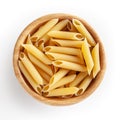 Uncooked penne pasta in wooden bowl isolated on white background Royalty Free Stock Photo