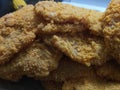 Uncooked pork battered with breadcrumbs