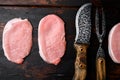 Uncooked pork chop, on old dark  wooden table background, top view flat lay Royalty Free Stock Photo