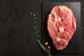 Uncooked Pork Ham steak on a stone kitchen cutting board. Royalty Free Stock Photo