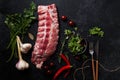 Uncooked pork ribs on dark textured background Royalty Free Stock Photo