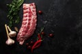 Uncooked pork ribs on dark textured background Royalty Free Stock Photo