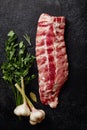 Uncooked pork ribs on dark textured background Royalty Free Stock Photo