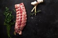 Uncooked pork ribs on dark textured background Royalty Free Stock Photo