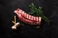 Uncooked pork ribs on dark textured background Royalty Free Stock Photo