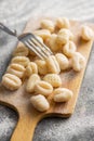 Uncooked potato gnocchi on cutting board. Tasty italian food