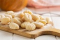 Uncooked potato gnocchi on cutting board. Tasty italian food