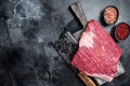 Uncooked Raw beef brisket meat on butcher board. Black background. Top view. Copy space Royalty Free Stock Photo