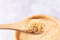 Uncooked raw dry bulgur grain in a bowl and in a wooden spoon Royalty Free Stock Photo